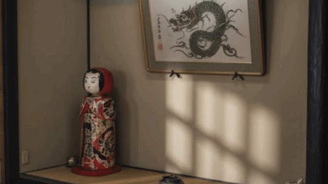 A subtle and respectful image showing traditional Japanese symbolism, shadows and calm lighting, no explicit crime imagery, realistic photo style, educational and neutral tone, not intimidating